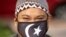 A Muslim man wearing a protective mask prepares to pray outside the closed National Mosque while celebrating Eid al-Fitr, the Muslim festival marking the end the holy fasting month of Ramadan, amid the coronavirus outbreak, in Kuala Lumpur, May 24, 2020.