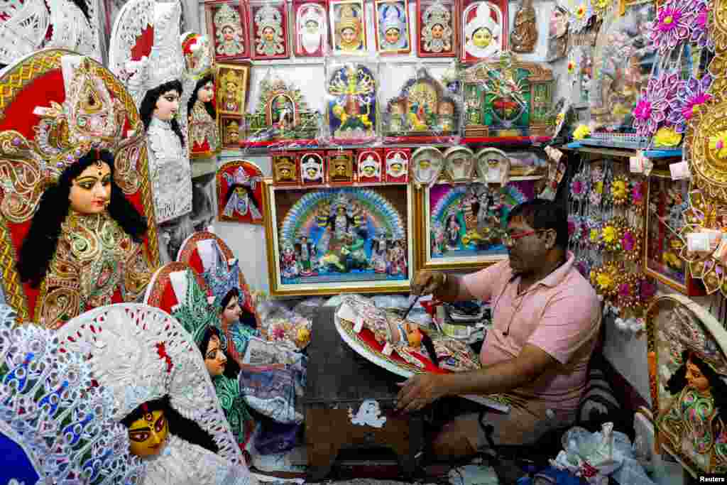 An artist paints a Hindu goddess&nbsp;Durga&nbsp;piece inside a store ahead of the&nbsp;Durga&nbsp;Puja&nbsp;festival in Kolkata, India.