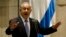 FILE - The government of Israeli Prime Minister Benjamin Netanyahu, who is shown speaking during a Knesset session in October 2014, said funds would be sent to the Palestinian Authority for humanitarian reasons and "Israel's interests.'' 