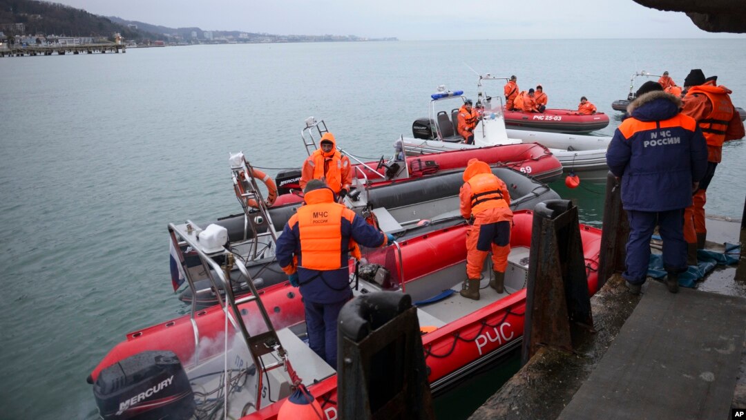 Ministry of Emergency Situations employees prepare rescue boats at a pier just outside Sochi, Russia, Dec. 26, 2016. 