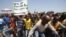 Striking platinum miners march near the Anglo-American Platinum (AMPLATS) mine near Rustenburg in South Africa's North West Province, October 5, 2012. 