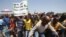 Striking platinum miners march near the Anglo-American Platinum mine near Rustenburg in South Africa's North West Province, October 5, 2012. 