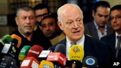 In this photo released by the Syrian official news agency SANA, United Nations special envoy to Syria Staffan de Mistura, speaks during a press conference in Damascus, Syria, Nov. 11, 2014. 