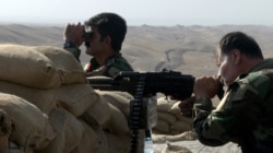 FILE - Militiamen of the Kurdistan Freedom Party, an Iranian Kurdish opposition group, the frontline near Kirkuk, Iraq, Sept. 5, 2016. The armed Kurdish group in Iran says it received military weapons and training as part of the war against Islamic State.