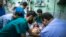 Shahed Qishtah, a nine-year-old Palestinian girl, receives medical care at an emergency room of the Kamal Adwan hospital in Beit Lahia after she was injured in an Israeli strike while playing on July 22, 2014 in the northern Gaza Strip. 