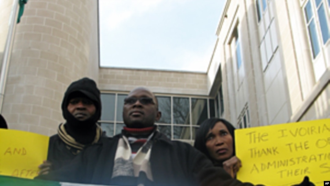 Protesters in front of the Ivory Coast embassy in Washington, DC, 30 Dec 2010