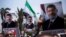 Supporters hold posters of Egypt's Islamist President Mohammed Morsi during a rally near Cairo University Square in Giza, Egypt, Tuesday, July 2, 2013. Egypt was on edge Tuesday following a "last-chance" ultimatum the military issued to Mohammed Morsi, gi