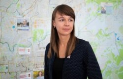 Municipal candidate and Alexei Navalny ally Ksenia Fadeeva poses for a portrait in a local campaign office in Tomsk, Russia, Sept. 12, 2020.