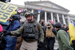 FILE - Members of the Oath Keepers are seen among supporters of U.S. President Donald Trump at the U.S. Capitol during a protest in Washington, Jan. 6, 2021.