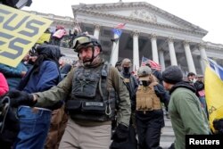 FILE - Members of the Oath Keepers are seen among supporters of U.S. President Donald Trump at the U.S. Capitol during a protest in Washington, Jan. 6, 2021.