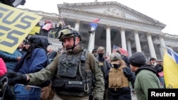 FILE - Members of the Oath Keepers are seen among supporters of U.S. President Donald Trump at the U.S. Capitol during a protest in Washington, Jan. 6, 2021.