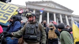 FILE - Members of the Oath Keepers are seen among supporters of U.S. President Donald Trump at the U.S. Capitol during a protest in Washington, Jan. 6, 2021.