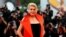FILE - French actor Catherine Deneuve poses at the red carpet for the movie "The Truth" (La Verite) presented in competition at the 76th Venice Film Festival, in Venice, Italy, Aug. 28, 2019. 