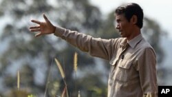 Chut Wutty, former Director of the Natural Resource Protection Group, gestures at Botum Sakor National Park in Koh Kong province, Cambodia, file photo.) 