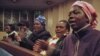 Zimbabwean women at a church in Johannesburg clap, sing and pray for better days