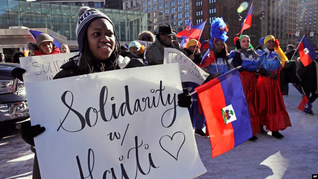 FILE - Haitian activists and immigrants protest on City Hall Plaza in Boston, Jan. 26, 2018.