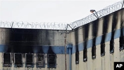 An area of the San Miguel prison is burned after a fire killed at least 83 prisoners in Santiago, Chile, 08 Dec. 2010