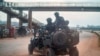 FILE - Security forces patrol the streets on election day in Kampala, Uganda, Jan. 14, 2021.