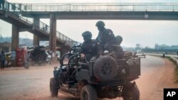 FILE - Security forces patrol the streets on election day in Kampala, Uganda, Jan. 14, 2021.