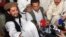 FILE - Pakistan Taliban commander Hakimullah Mehsud (L) is seen during a news conference in South Waziristan, May 24, 2008. 