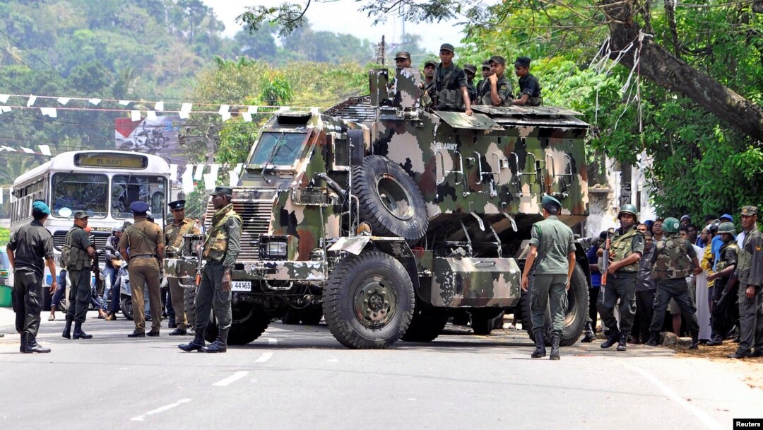 Sri Lanka's army soldiers stand guard a road after a clash between two communities in Digana, central district of Kandy, Sri Lanka, March 6, 2018.