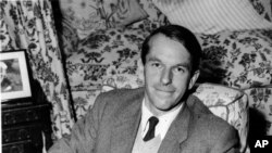 FILE - In this Oct. 28, 1958 file photo, Dr. Frederick Sanger, research Biochemist at Cambridge University, poses in his home in Cambridge, England.