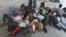 People from India's northeastern states, take a nap at a platform while waiting for the train to board back to their homes at a railway station in the southern Indian city of Chennai, August 17, 2012.