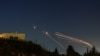 Israel's Iron Dome antimissile system intercepts rockets launched by Hezbollah from Lebanon toward Israel, as seen from northern Israel on April 12, 2024.