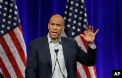 Democratic presidential candidate Sen. Cory Booker, D-N.J., gestures while speaking at the Democratic National Committee's summer meeting Friday, Aug. 23, 2019, in San Francisco. More than a dozen Democratic presidential hopefuls are making their…