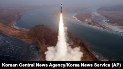 This photo provided by the North Korean government shows what it says a test fire of new type intermediate-range hypersonic ballistic missile at an undisclosed place in North Korea, Jan. 6, 2025. (Korean Central News Agency/Korea News Service via AP)