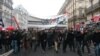 Demonstrators march at the Place de La Republique, rallying against labor reforms proposed by the leftist government, Paris, France, March 9, 2016. (L. Bryant/VOA)