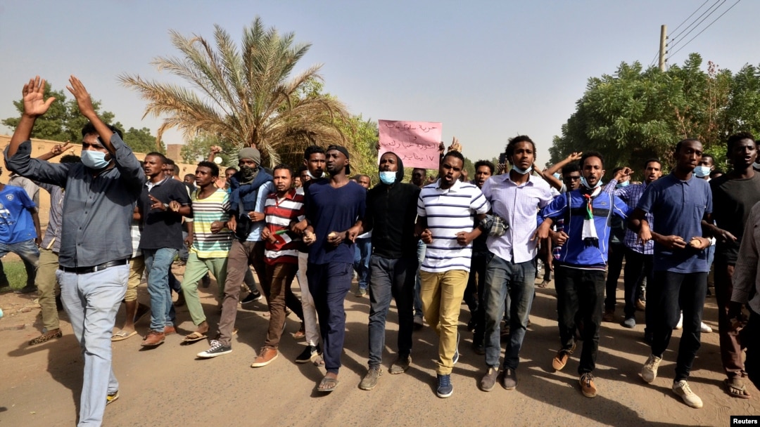 FILE - Sudanese demonstrators chant slogans as they participate in anti-government protests in Khartoum, Sudan, Jan. 17, 2019. 