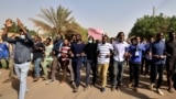 Sudanese demonstrators chant slogans as they participate in anti-government protests in Khartoum, Sudan, Jan. 17, 2019. Rudwan Dawod, a political activist with the group Sudan of the Future Campaign, vanished hours before the protests were slated to begin Thursday, his wife said.