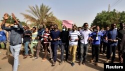 Sudanese demonstrators chant slogans as they participate in anti-government protests in Khartoum, Sudan, Jan. 17, 2019. Rudwan Dawod, a political activist with the group Sudan of the Future Campaign, vanished hours before the protests were slated to begin Thursday, his wife said.