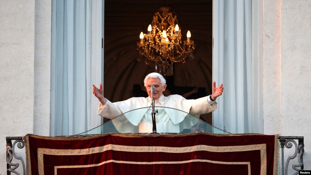 Pope Benedict waves to the faithful from the balcony of his summer residence in Castel Gandolfo, Feb. 28, 2013. 