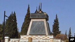 An empty plinth at the site where the statue of late Syria President Hafez al-Assad was torn down and burnt during protests in Deraa (File)