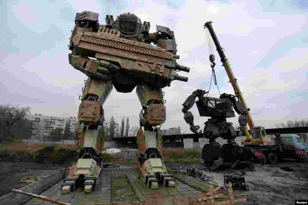 Robots made by local enthusiasts and employees of an automobile repair workshop are seen during installation works on the outskirts of the rebel-controlled city of Donetsk, Ukraine.