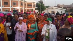 Nigerian women participate in a candlelight procession to remember victims of sexual violence in Abuja, Nigeria, Nov. 25, 2019. (Timothy Obiezu/VOA)