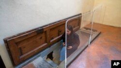 The trapdoor leading to a room with delicate charcoal drawings on the walls that some experts have attributed to Michelangelo is seen inside Florence's Medici Chapel, in central Italy, Tuesday, Oct. 31, 2023. (AP Photo/Luigi Navarra)