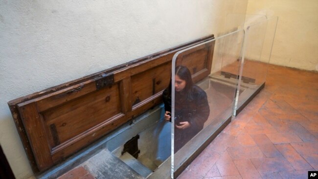 The trapdoor leading to a room with delicate charcoal drawings on the walls that some experts have attributed to Michelangelo is seen inside Florence's Medici Chapel, in central Italy, Tuesday, Oct. 31, 2023. (AP Photo/Luigi Navarra)