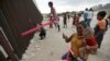 Pink Seesaws Bridge US-Mexico Border Divide