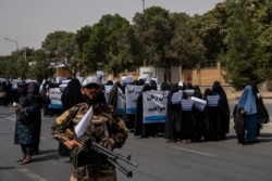 Women march in support of the Taliban government outside Kabul University, Afghanistan, Sept. 11, 2021.