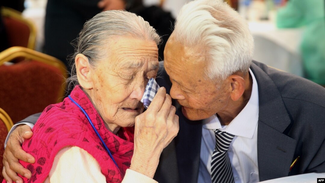 FILE - South Korean Kwon O-Hui (L) cries with her North Korean relative Ri Han-Sik (R) as they bid farewell following their three-day family reunion meeting at the Mount Kumgang resort on the North's southeastern coast, Oct. 22, 2015.