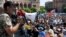 Armenian opposition leader Nikol Pashinyan (L) addresses supporters during a rally in Yerevan, Armenia, April 26, 2018. 
