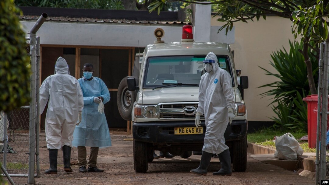 FILE - Medical workers are seen outside the COVID-19 treatment center at Kamuzu Central Hospital in Lilongwe, Malawi, Jan. 18, 2021. Teachers in the country went on strike Feb. 22, 2021, demanding adequate safety equipment and better pay. (L. Masina/VOA)