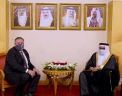 FILE - US Secretary of State, Mike Pompeo meets with Bahrain Foreign Minister Abdullatif bin Rashid al-Zayani during his visit to Manama, Bahrain, Aug. 25, 2020. (Bahrain News Agency/Handout via Reuters)