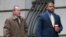 FILE - William Porter, right, one of six Baltimore city police officers charged in connection to the death of Freddie Gray, walks into a courthouse with his attorney Joseph Murtha for jury selection in his trial, in Baltimore, Nov. 30, 2015.
