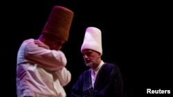 FILE - Whirling dervishes perform a "Sema" ritual during a ceremony in memory of Mevlana Jalaluddin Rumi, an Anatolian mystic, poet and the father of the Mevlevi order, in Istanbul, Turkey, December 17, 2023.