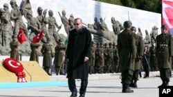 Turkey's President Recep Tayyip Erdogan walks during a ceremony marking the 102nd anniversary of the country's historic Canakkale battle, in Gallipoli peninsula, March 18, 2017. 