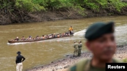 Migrants arrive at the migrant reception center after crossing the Darien Gap, in the village of Lajas Blancas, Darien Province, Panama, Sept. 26, 2024. 